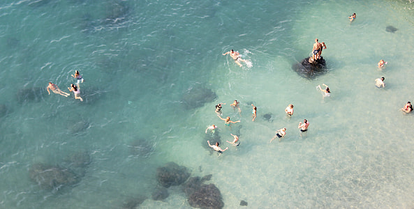 people on body of water during daytime thumbnail