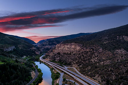aerial photography of road between mountains thumbnail