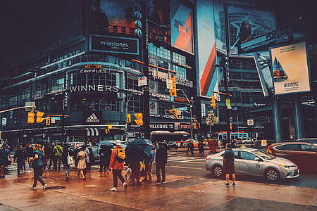 People Walking Near Crossroad Beside Building thumbnail