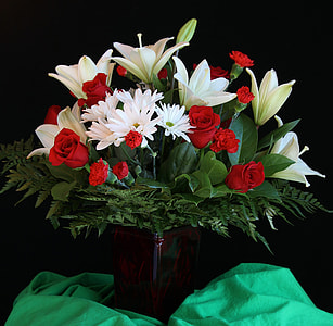 still life photography of red roses and white daisy flower arrangement thumbnail
