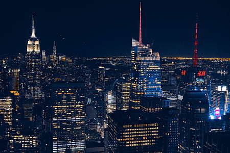 aerial photography of high rise buildings during nighttime thumbnail