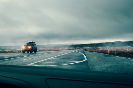 black off-road car cruising on free way thumbnail
