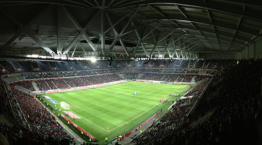 crowd of people watching football game inside stadium thumbnail