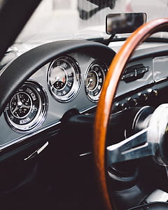 selective focus close up photography of classic vehicle analog instrument cluster panel thumbnail