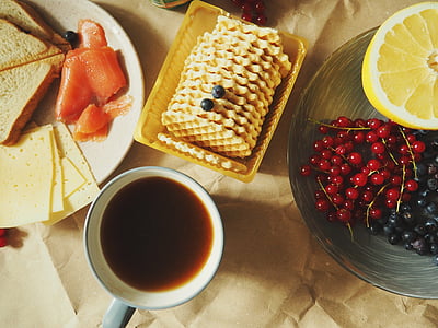 waffle beside bread and cherry on top of table thumbnail