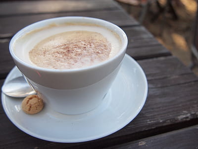 close-up photo of white ceramic tea cup on white saucer thumbnail