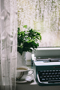 Working with old typewriter in the rainy day thumbnail
