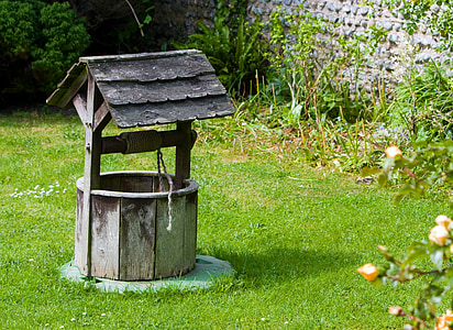 brown wooden water well near green turf thumbnail