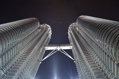 low angle photography of twin tower during night time thumbnail