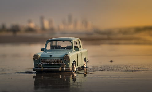 blue car on body of water photo thumbnail