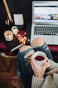Woman drinking hot tea in her home office thumbnail