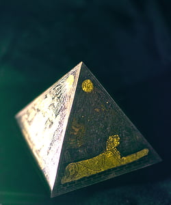 Pyramid miniature placed on black surface thumbnail