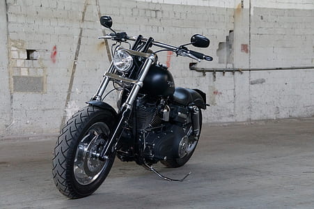 parked black cruiser motorcycle thumbnail
