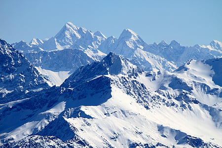 snow covered mountain over blue sky thumbnail