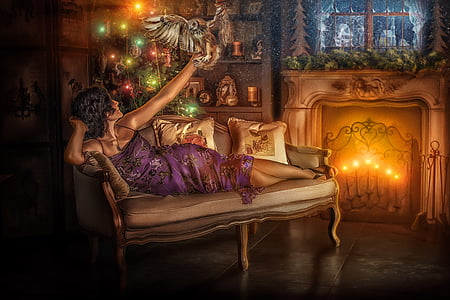 black hair woman in purple dress lying on sofa while holding bird during night time thumbnail