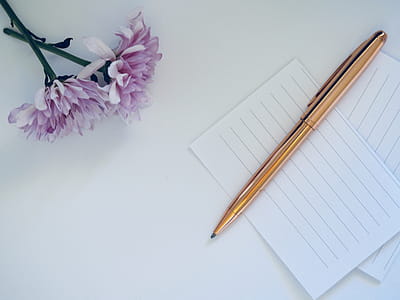 Gold Twist Pen On White Paper thumbnail