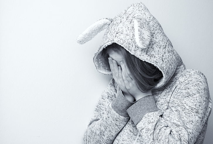 sad girl in hoodie