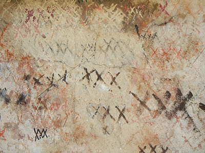x marks on beige surface thumbnail