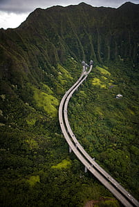 aerial view of road going to mountain during dyatime thumbnail