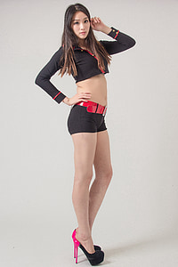 woman wearing black crop top and black short shorts thumbnail