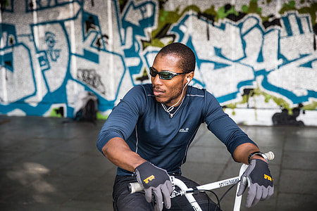 Portrait shot of a man in sunglasses sitting on a BMX bike, this image was captured on the Southbank in London using a Canon 6D DSLR thumbnail