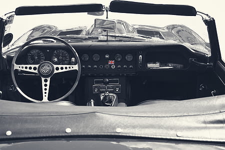 grayscale photo of open convertible car thumbnail