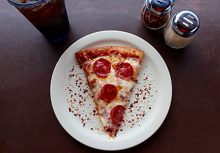 Sliced Pepperoni Pizza on White Ceramic Plate thumbnail