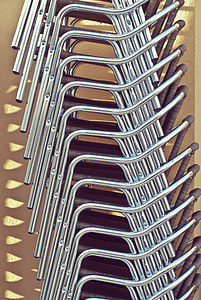gray stainless steel framed black padded armchairs thumbnail