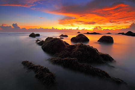 gray rock in body of water thumbnail
