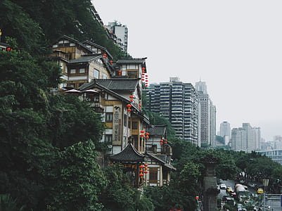 brown buildings on mountains thumbnail