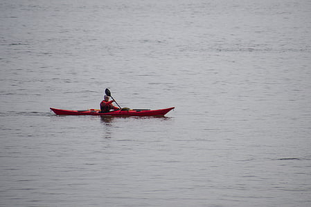 man kayaking on body of water thumbnail