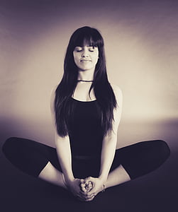 woman in black sleeveless shirt meditating thumbnail