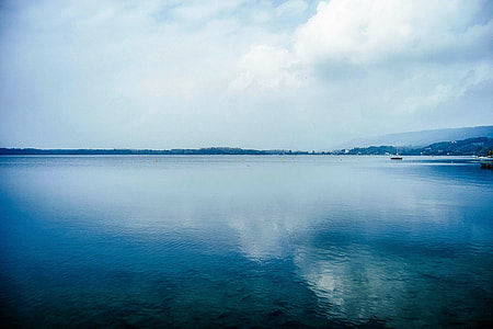 calm water under blue skies thumbnail