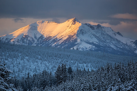 mountain covered with snow during daytime thumbnail