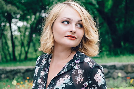 blonde haired woman black and pink floral top thumbnail