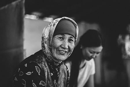 two woman smiling grayscale photography thumbnail