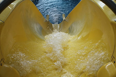 yellow pool slide with water thumbnail