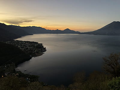 silhouette aerial photography of body of water thumbnail