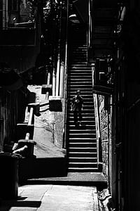 man standing on stairs thumbnail