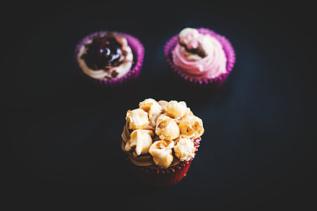 three cupcakes with icing toppings thumbnail