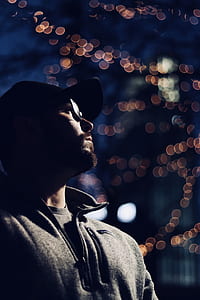 tilt shift photography of man in gray jacket thumbnail