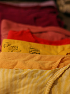 assorted-color shirts in selective focus photography thumbnail