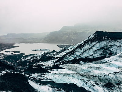 black mountains covered with snow thumbnail