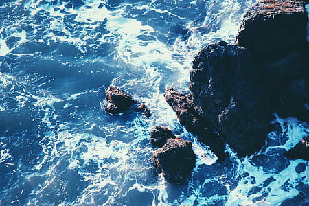 aerial photo of rock formation on body of wate thumbnail