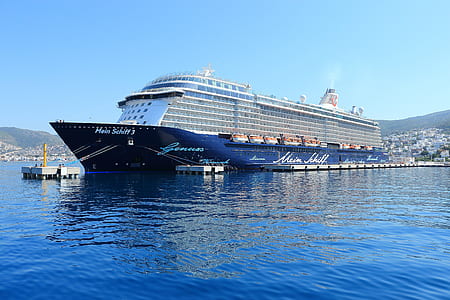 blue cruise ship on body of water thumbnail