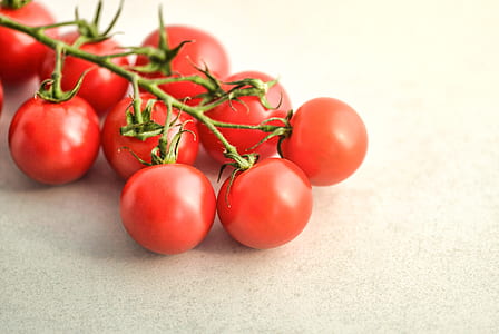 red tomatoes on white surface thumbnail