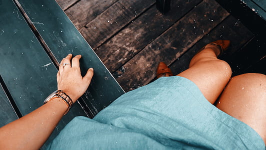 woman sitting on black bench thumbnail
