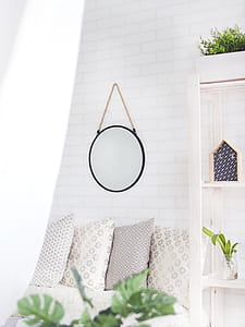 Round Black Framed Mirror on the Wall thumbnail