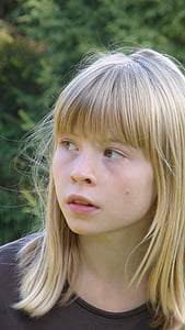 girl wearing black shirt near bush thumbnail