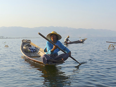 man rowing boat on sea thumbnail